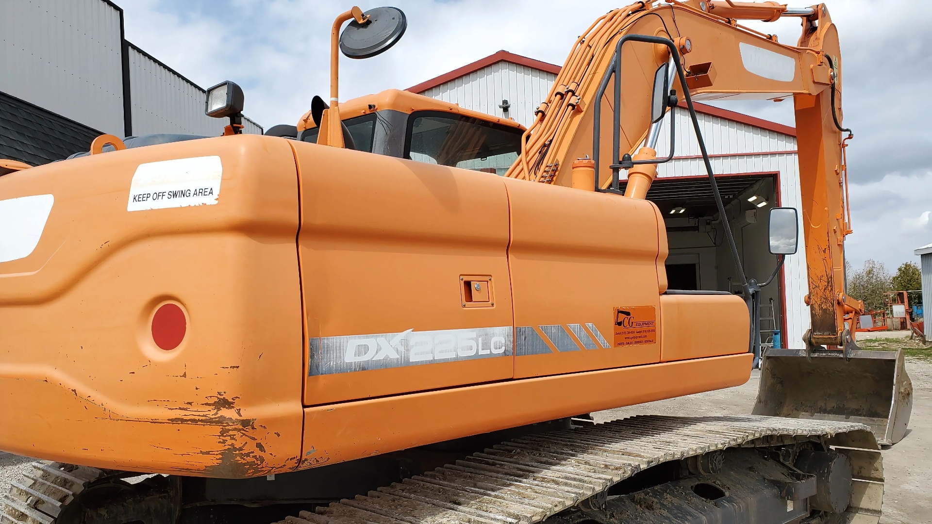 Faded chalky orange excavator before restoration